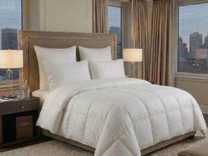 Luxury white striped duvet cover on an elegant modern bedroom